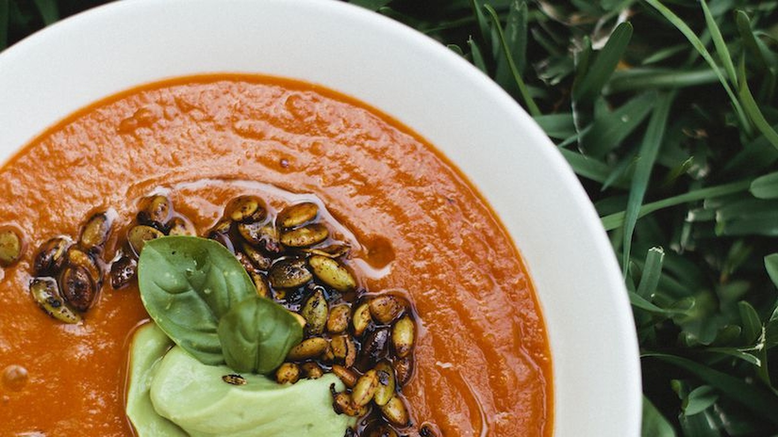 Roasted Tomato & Red Lentil Soup With Spicy Pepitas & Avocado Cream (Recipe)